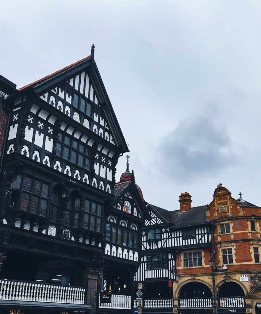a large building in Chester with a clock on the front of it